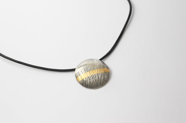 Textured oxidised silver, with a 24 carat gold stripe, choker. A wearable statement piece of jewellery