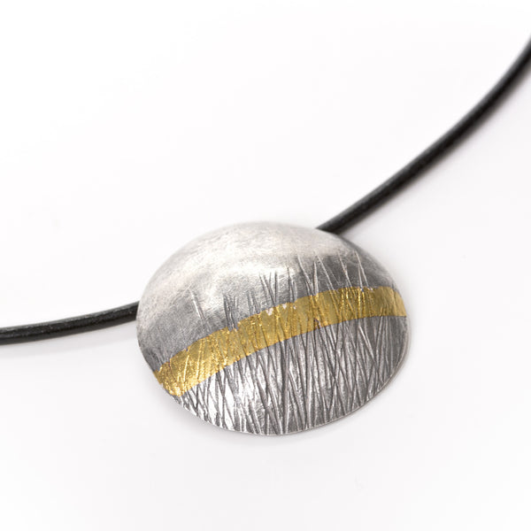 Textured oxidised silver, with a 24 carat gold stripe, choker. A wearable statement piece of jewellery