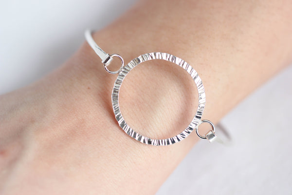 Textured circle, hooked bangle