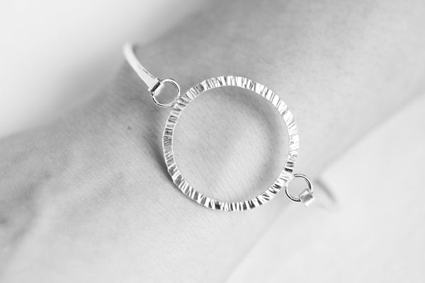 Textured circle, hooked bangle